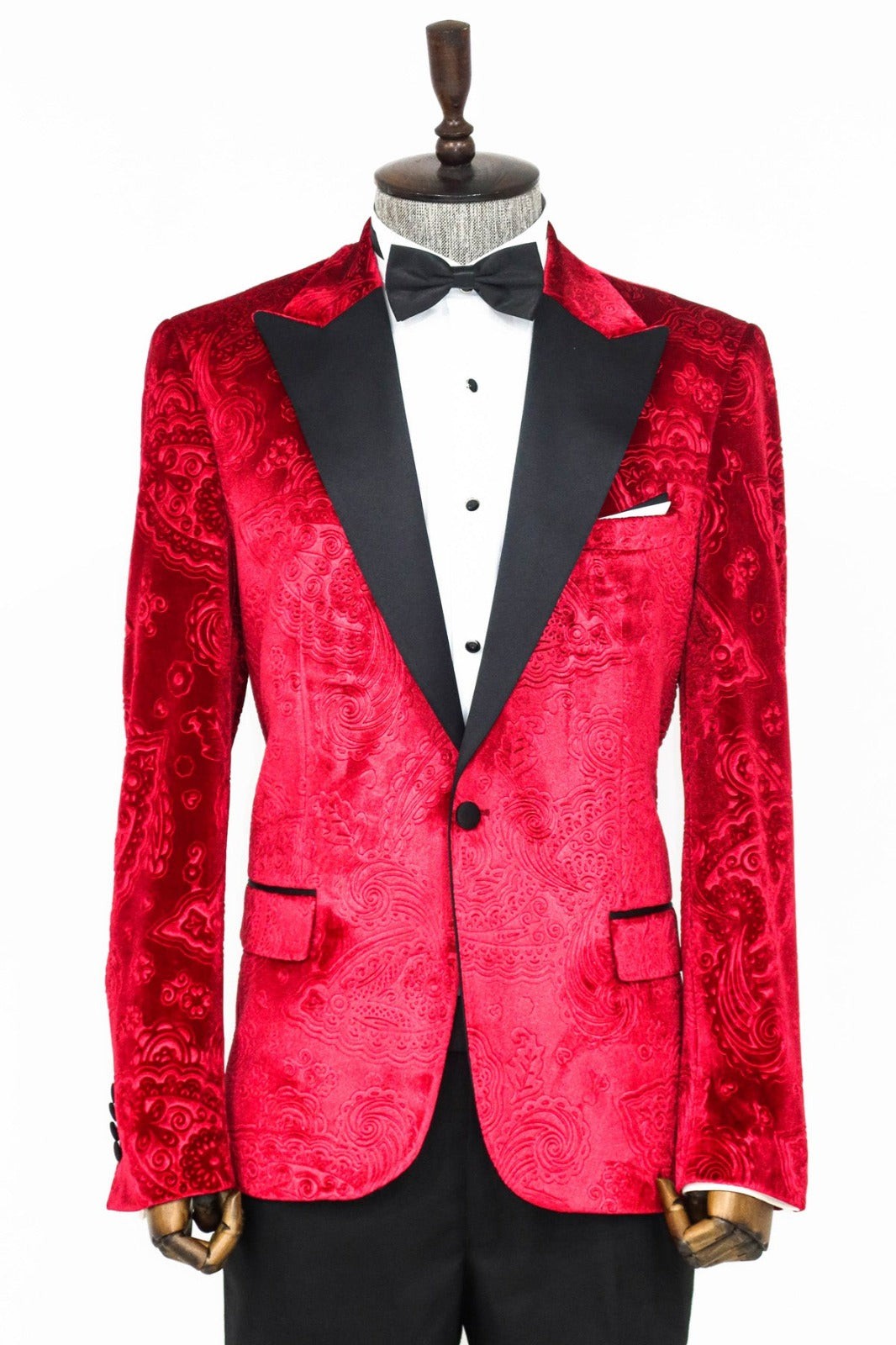 Man wearing a stylish Red Velvet Paisley Engraved Prom Blazer by KCT Menswear, showcasing elegance and sophistication in formal wear