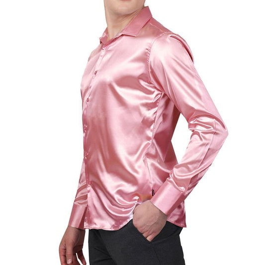 Stylish man in KCT Menswear's pink satin dress shirt, ideal for elevating formal wear.