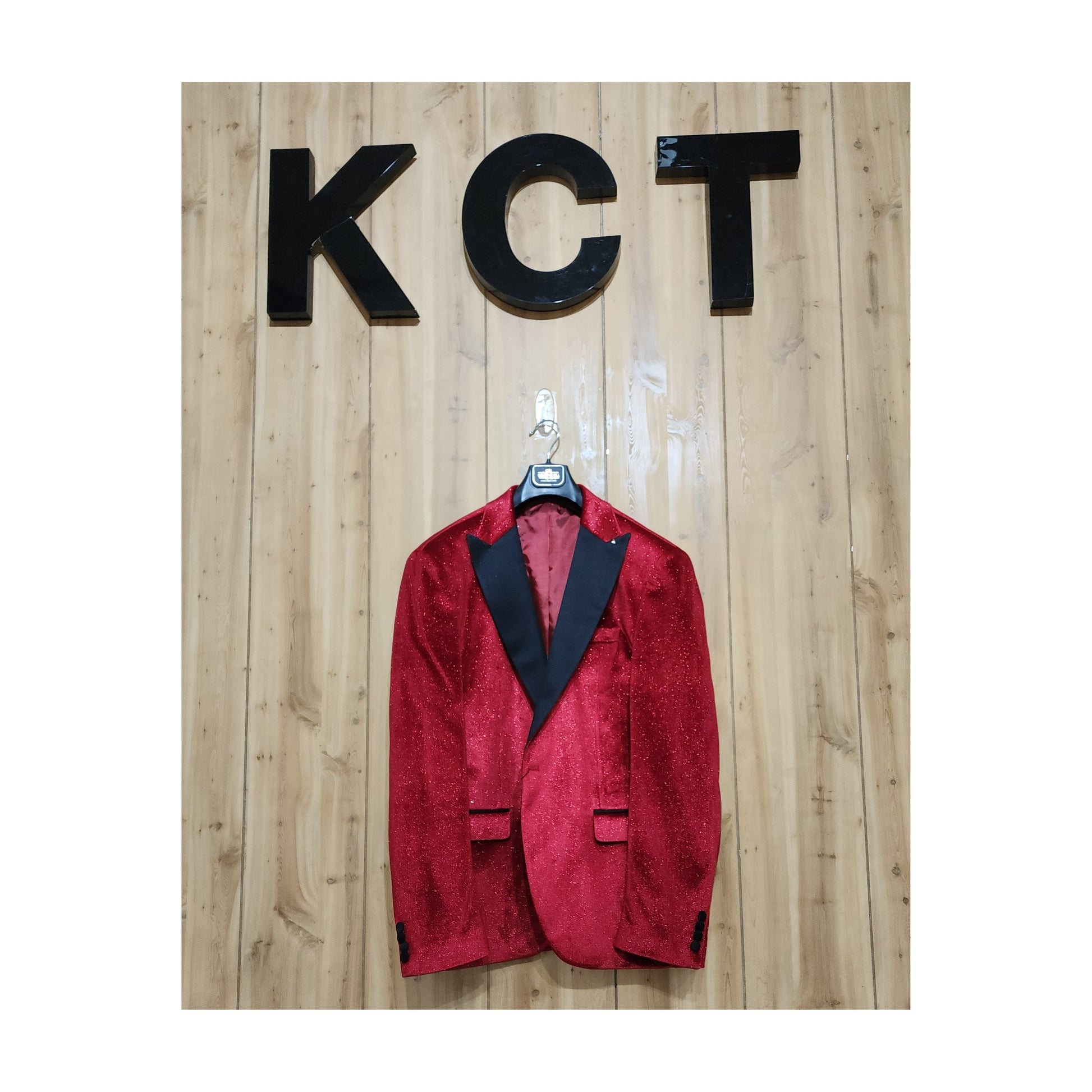 Man in KCT Menswear's red velvet sparkle blazer at a formal event