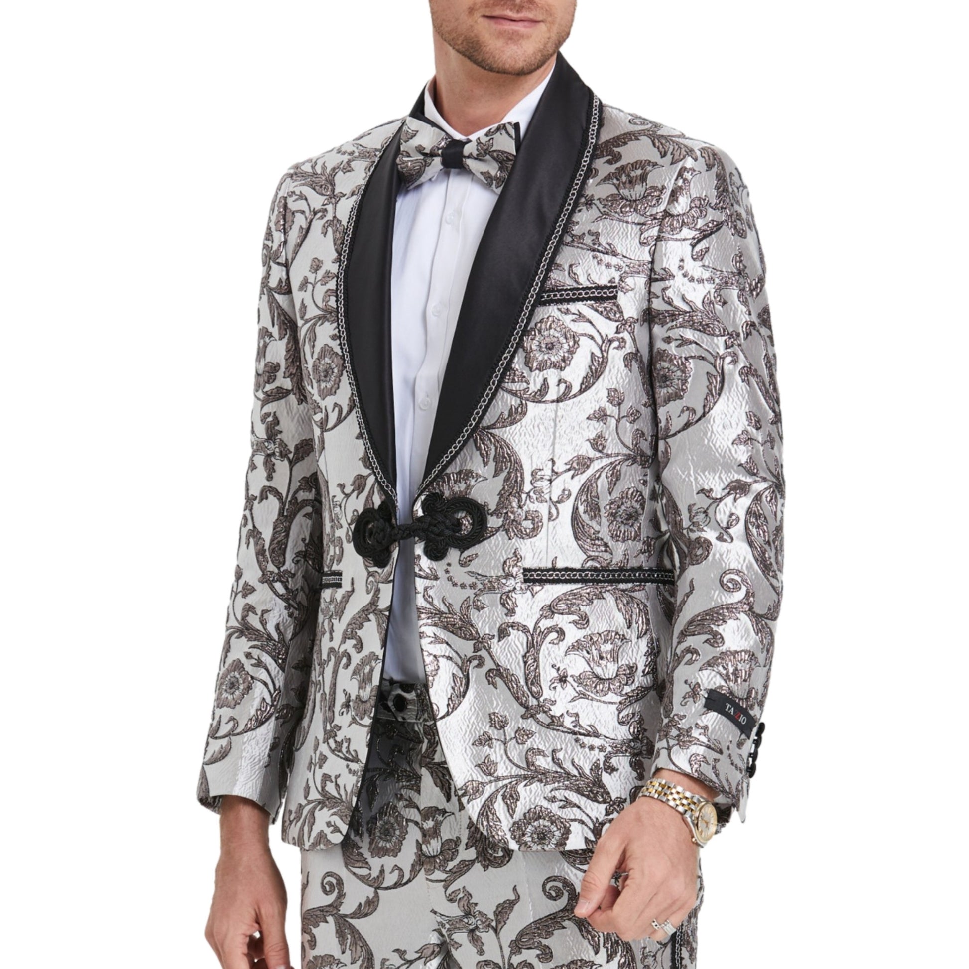 Shiny Silver Tuxedo with Black Paisley, Silver Paisley Design Pants, Black and Silver Lapel Detail, Shiny Silver Paisley Bowtie, Slim Fit Tuxedo Style.