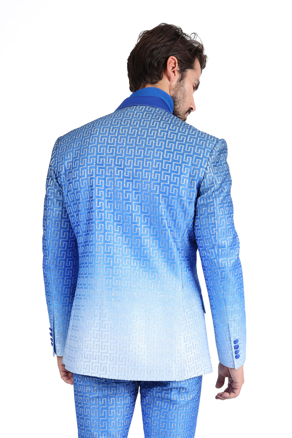 A stylish high school student wearing KCT Menswear's Dazzling Prom Blazer, showcasing its stunning two-tone blue and silver fading effect, and sparkling rhinestone Greek key pattern on collar and pockets - perfect for a memorable prom night.
