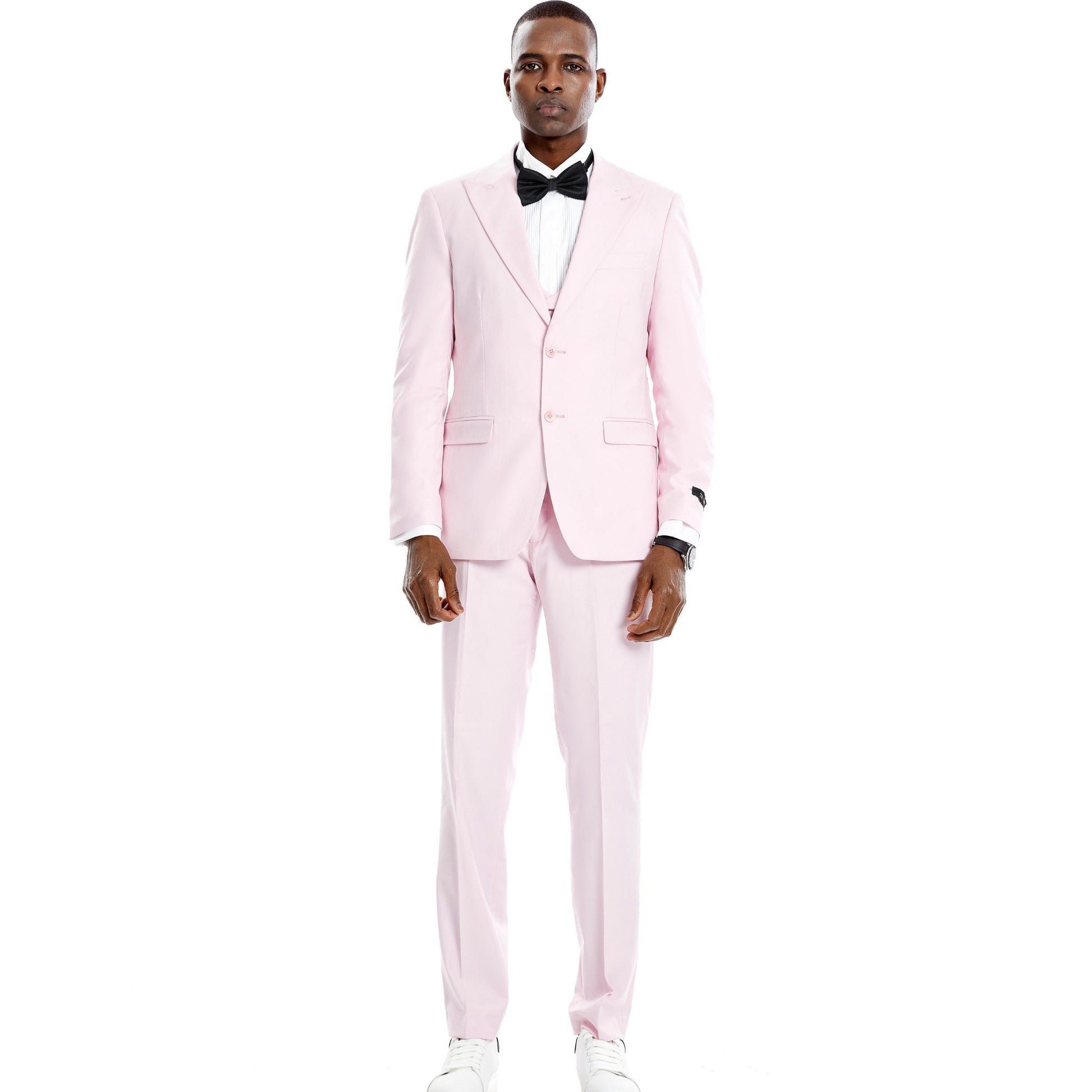Charming man dressed in a blush pink full suit for prom night.