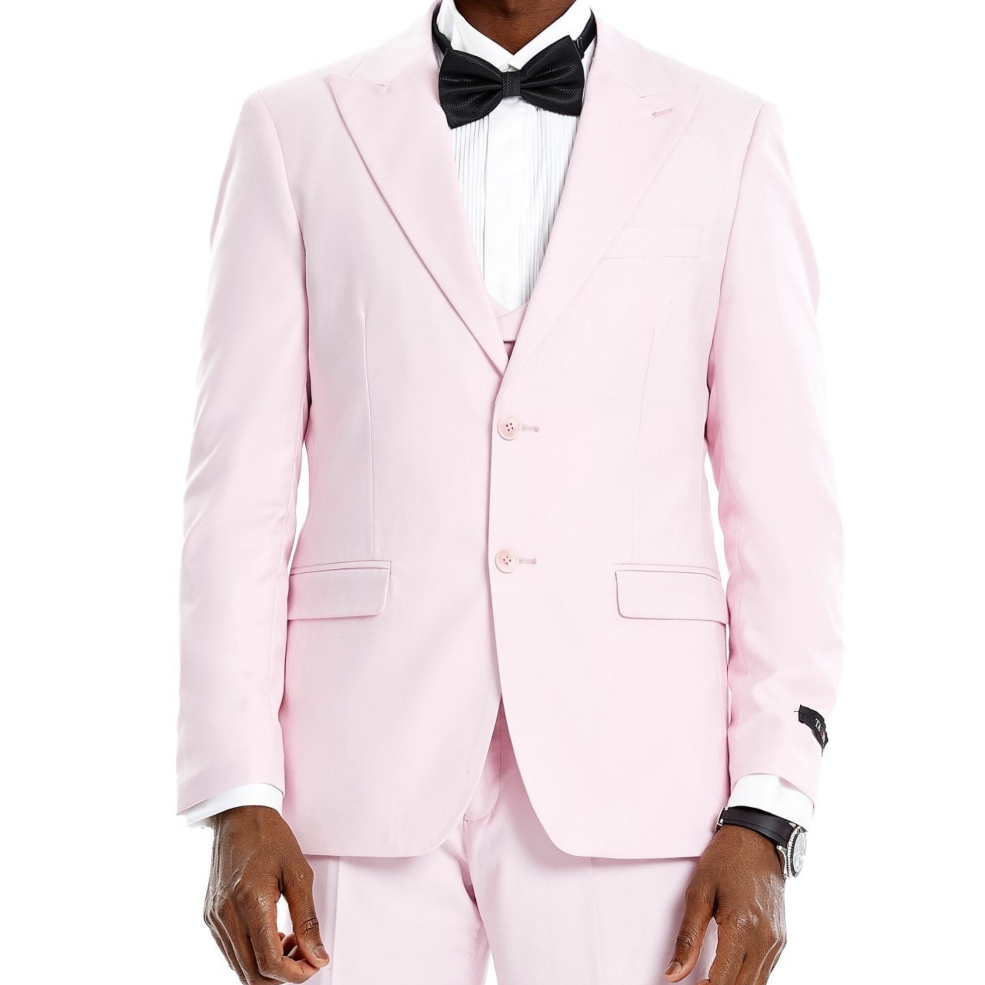 Charming man dressed in a blush pink full suit for prom night.