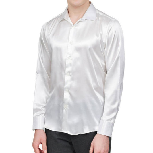 A sophisticated man donning the White Shiny Shirt by KCT Menswear, exemplifying its sleek design and glossy fabric, ideal for making a statement at formal gatherings