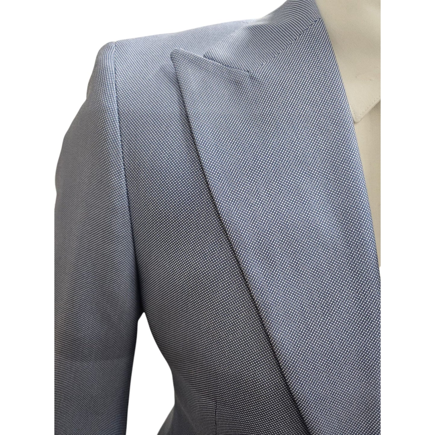 Close-up of Light Blue Three-Piece Suit, highlighting the premium notch lapel, fine fabric texture, and elegant detailing.