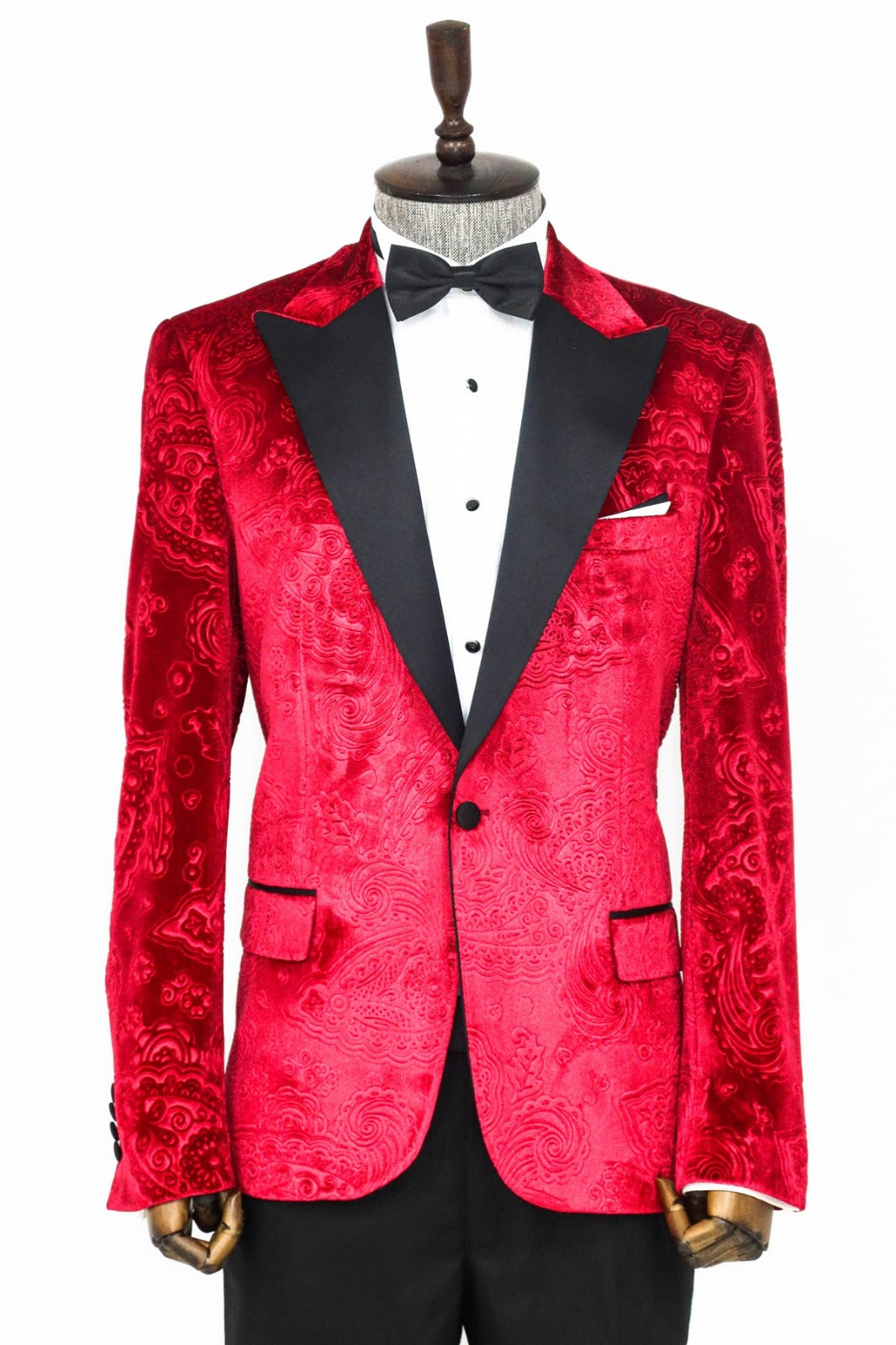 Man wearing a stylish Red Velvet Paisley Engraved Prom Blazer by KCT Menswear, showcasing elegance and sophistication in formal wear