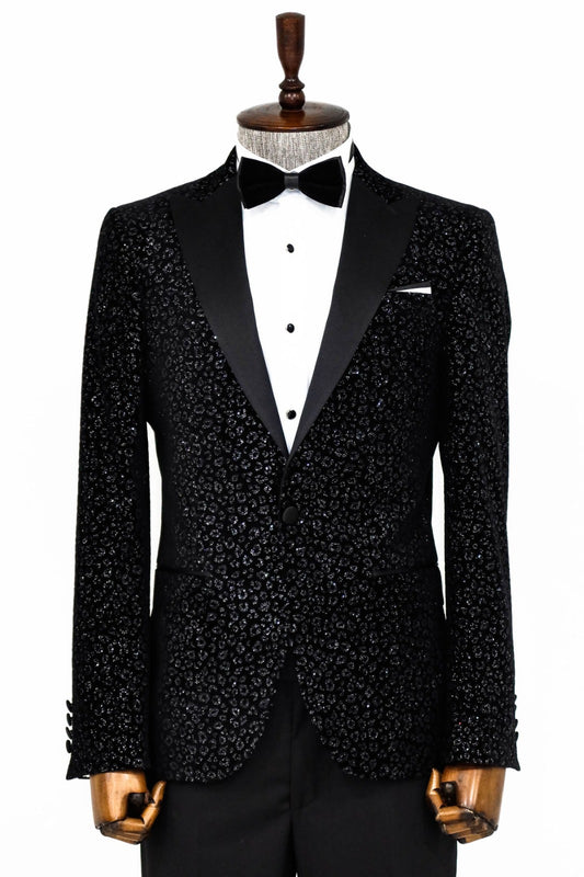 Man wearing a stylish Black Sparkle Cheetah Paisley Engraved Prom Blazer by KCT Menswear, showcasing elegance and sophistication in formal wear.