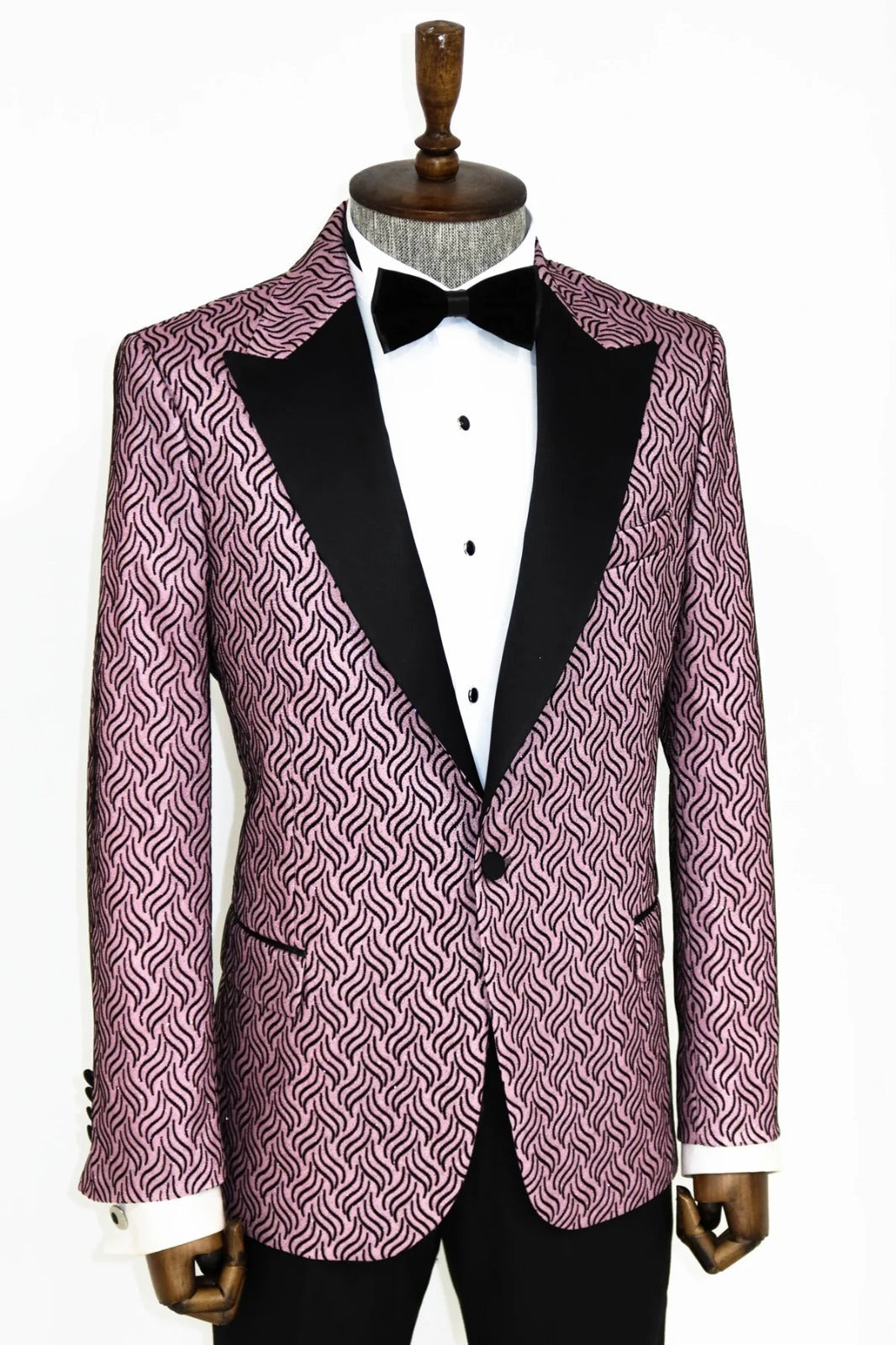 Man wearing a stylish Pink and Black Sparkle Blazer by KCT Menswear, showcasing elegance and sophistication in formal wear.
